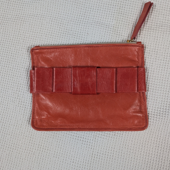 Punto Fibbia Handbags - Chic Coral Leather Clutch With Bow Made In Italy